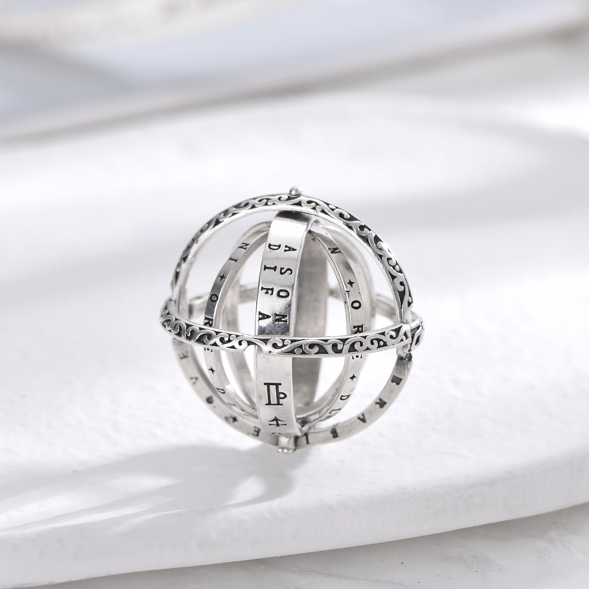 Silver celestial magic ring with Roman numerals and star pattern engraving
