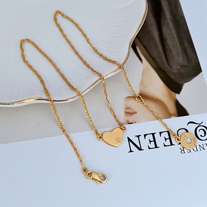 Gold matte heart pendant necklace with chain and small engraved charm