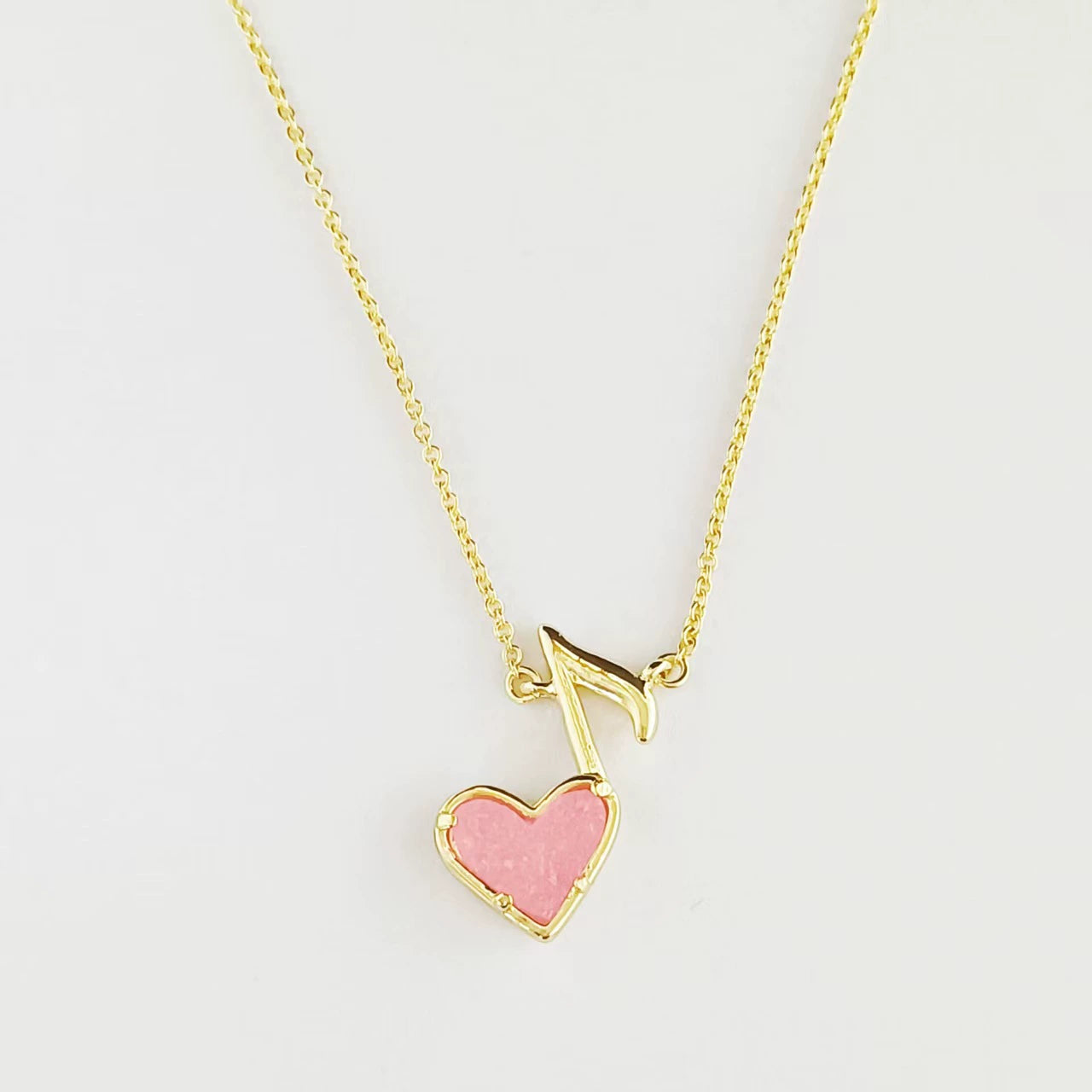 Heart and music note pendant necklace with pink heart, gold-tone chain