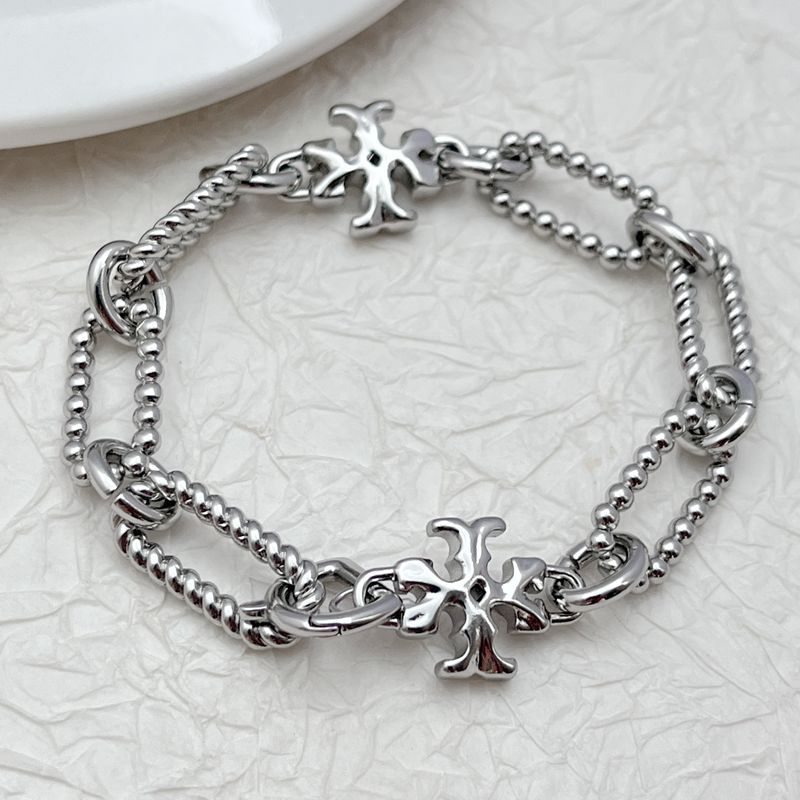 Silver square-logo chain bracelet with chunky links and stacked charm accents