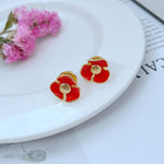 Enamel Camellia stud earrings, red flower with gold-tone trim
