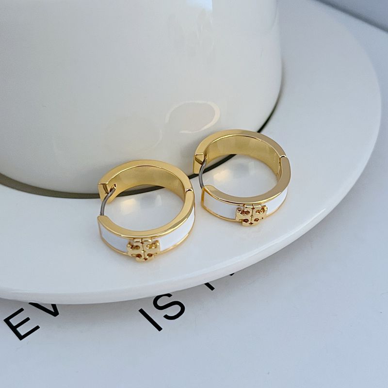 Gold-tone enamel hoop earrings with white round band and clasp