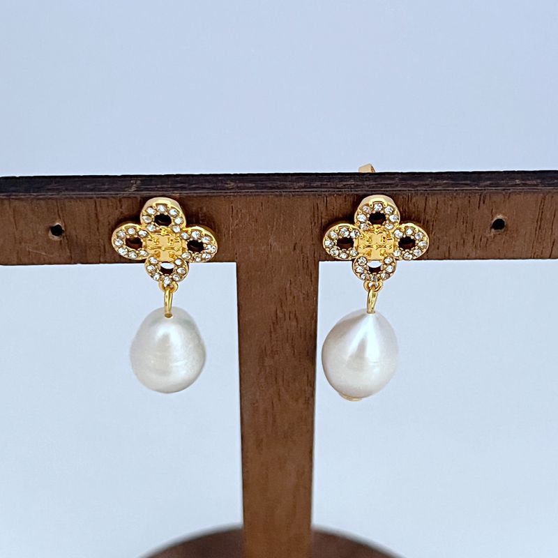 Gold clover crystal drop earrings with large white freshwater pearl