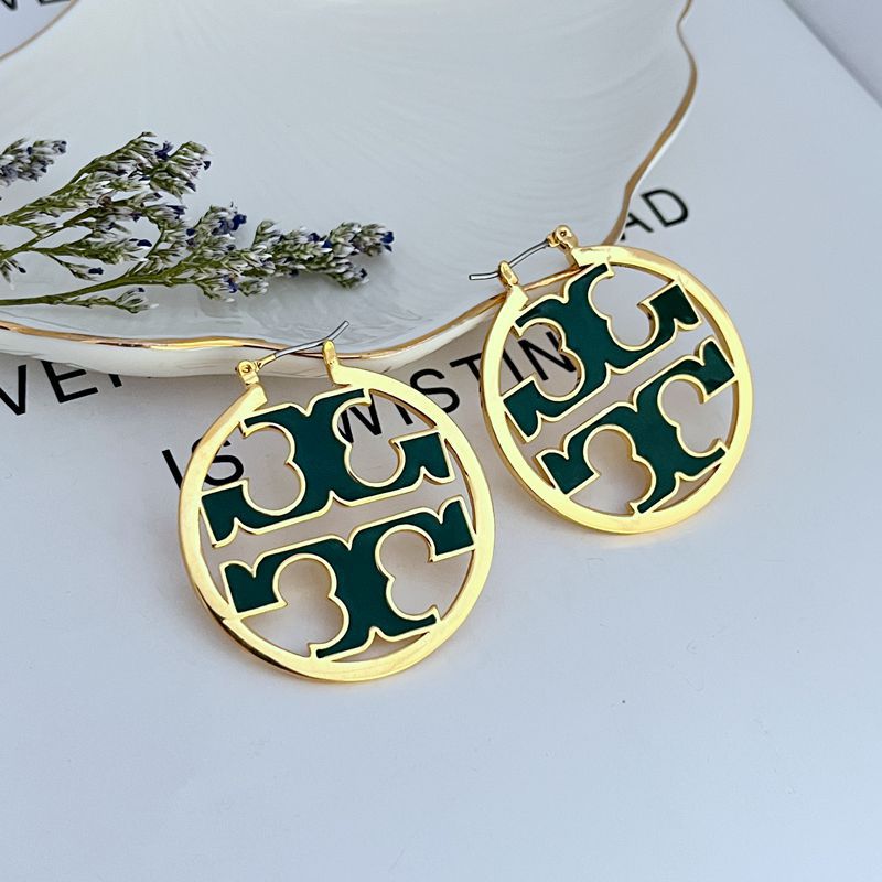 Gold-tone round enamel logo earrings with green cutout quatrefoil pattern