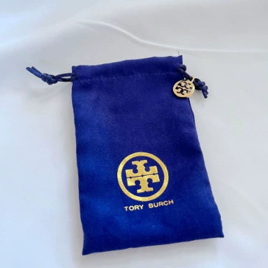 Blue Tory Burch fabric jewelry pouch with drawstring and gold logo medallion