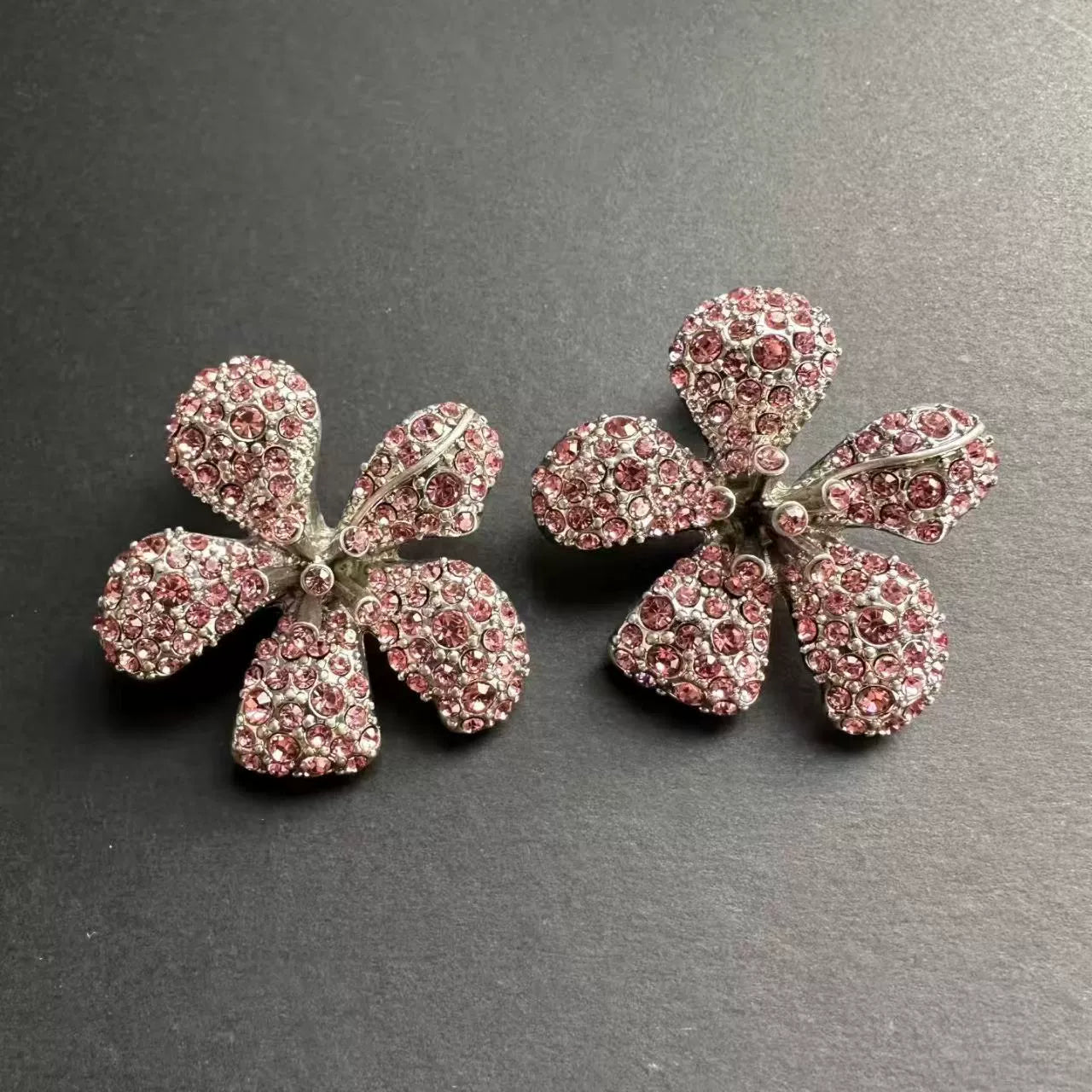 Large flower earrings with pink and clear crystal rhinestone petals, silver-tone