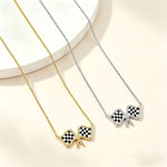 Gold chain necklace with two checkered flag bow pendants