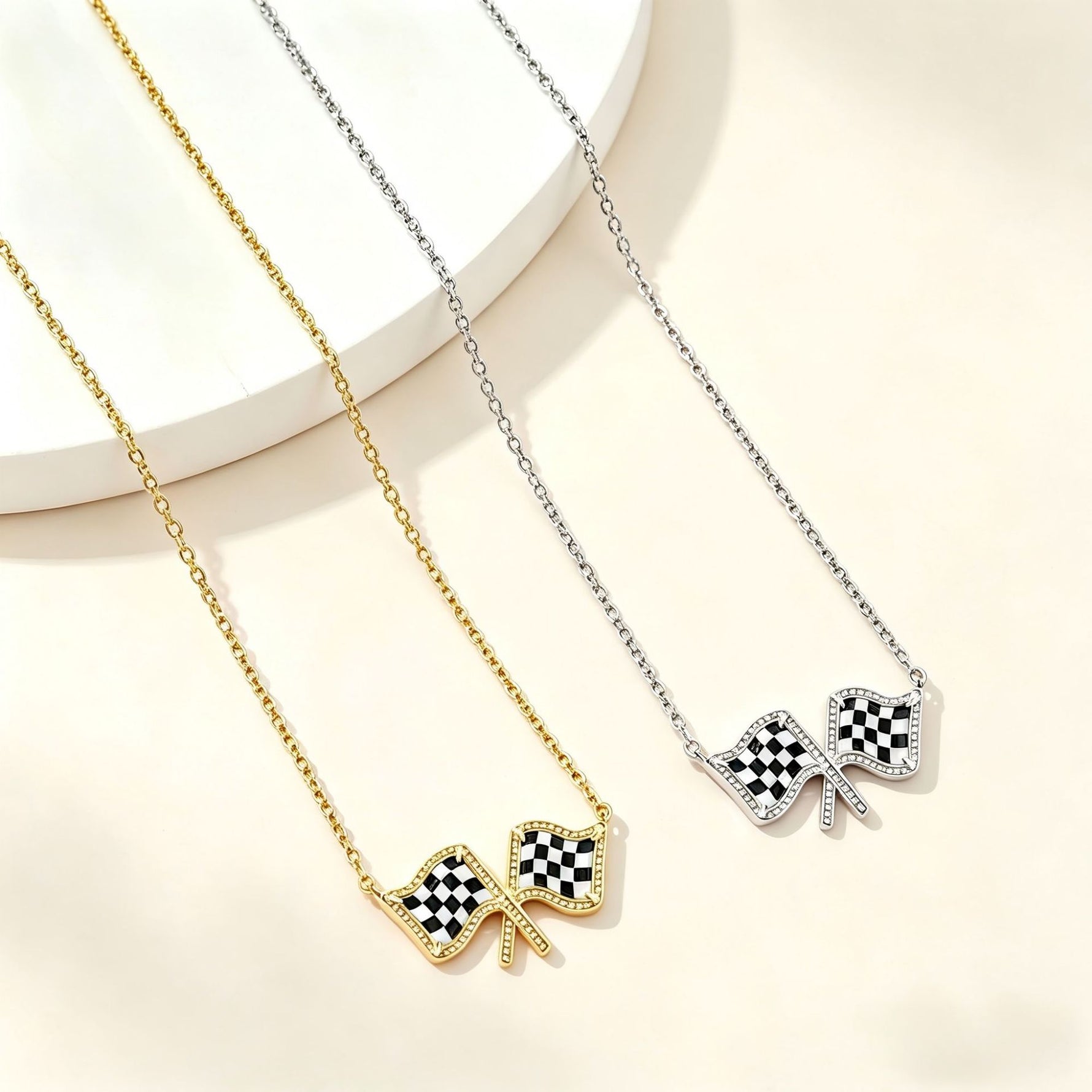 Gold chain necklace with two checkered flag bow pendants