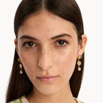 Gold-tone round crystal drop earrings with pink stones and dangling chain drops