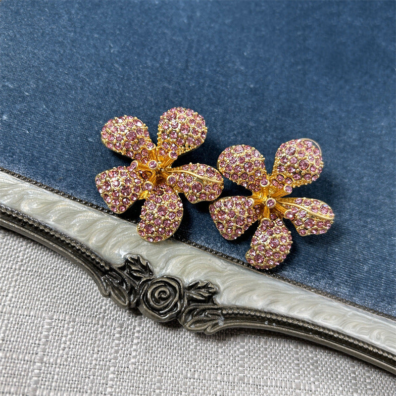 Diamond flower earrings, five-petal design with pink faceted pavé stones