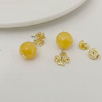 Yellow agate pendant earrings with gold logo stud and round bead drop