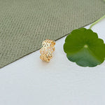 Gold-tone circular logo patchwork ring with openwork link band