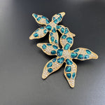 Starfish flower enamel earrings, blue teardrop spots with crystal accents, gold-tone