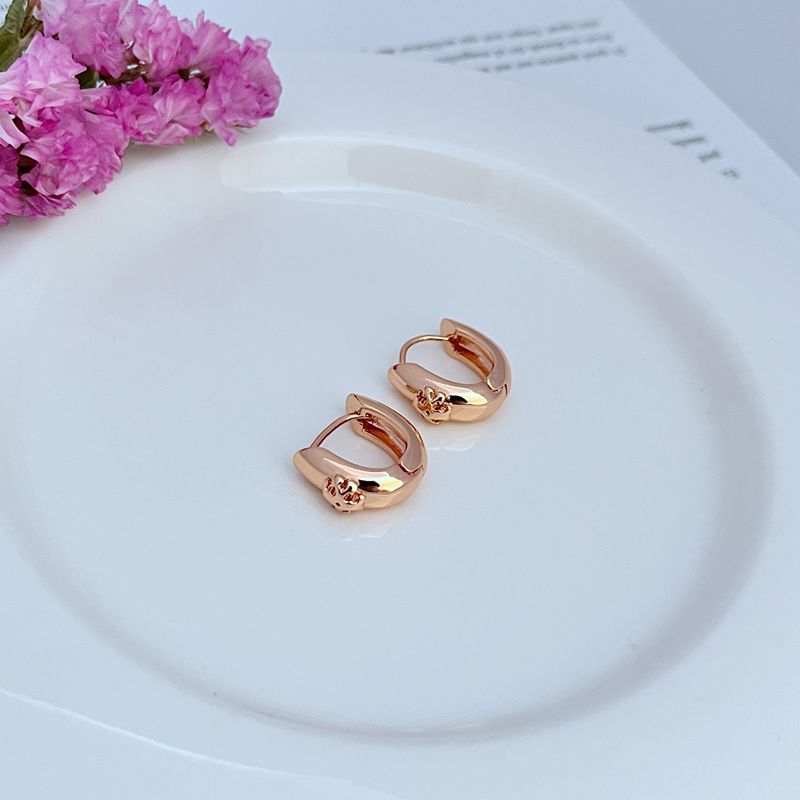 Petite U-shaped hoop earrings, rose gold tone, smooth finish