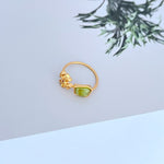 Tory Burch logo matte ring with green acrylic stone on gold-tone band