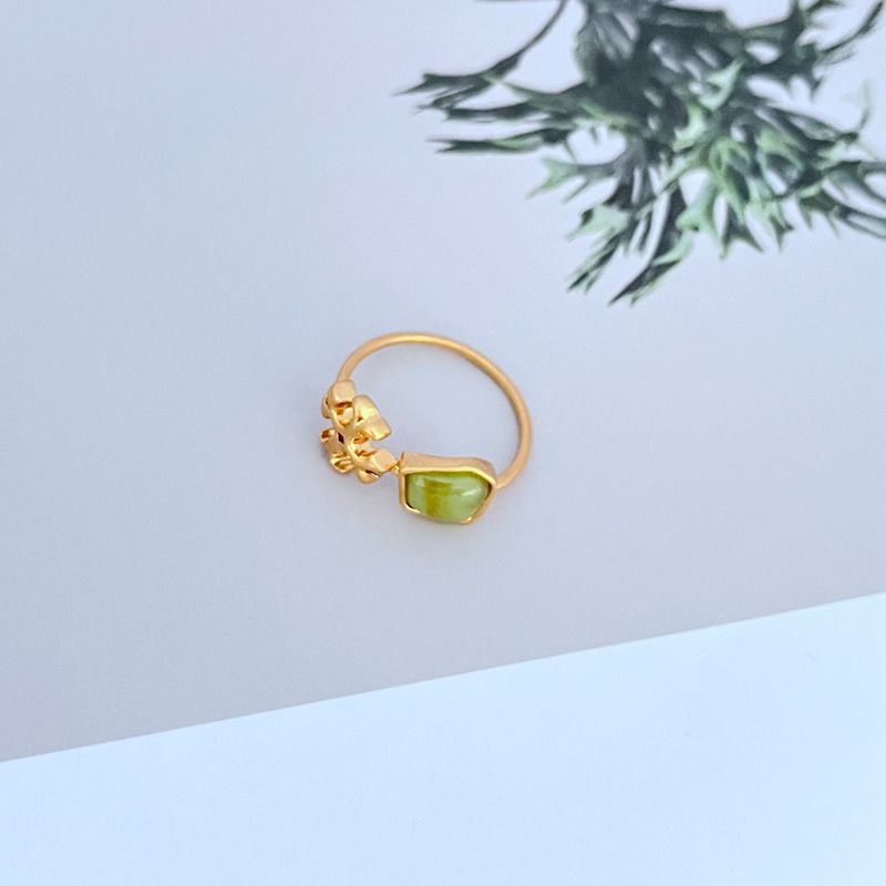 Tory Burch logo matte ring with green acrylic stone on gold-tone band