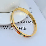 Tory Burch plaid enamel bangle with gold-tone hinge clasp and multicolor square accents