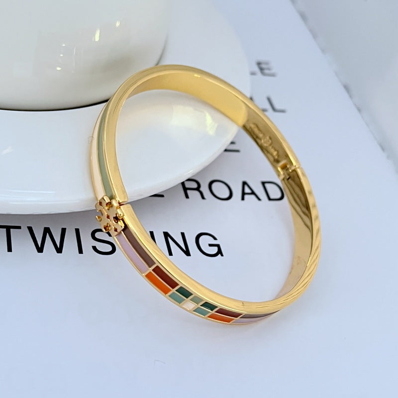 Tory Burch plaid enamel bangle with gold-tone hinge clasp and multicolor square accents