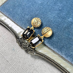 Earrings with dark rectangular stones and gold stud caps, square pendant dangle