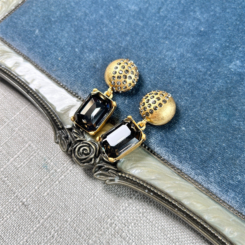 Earrings with dark rectangular stones and gold stud caps, square pendant dangle