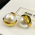 Pearl drop stud earrings with gold caps and hinged backs