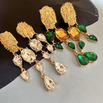 Gold crystal tassel earrings with green and amber teardrop stones