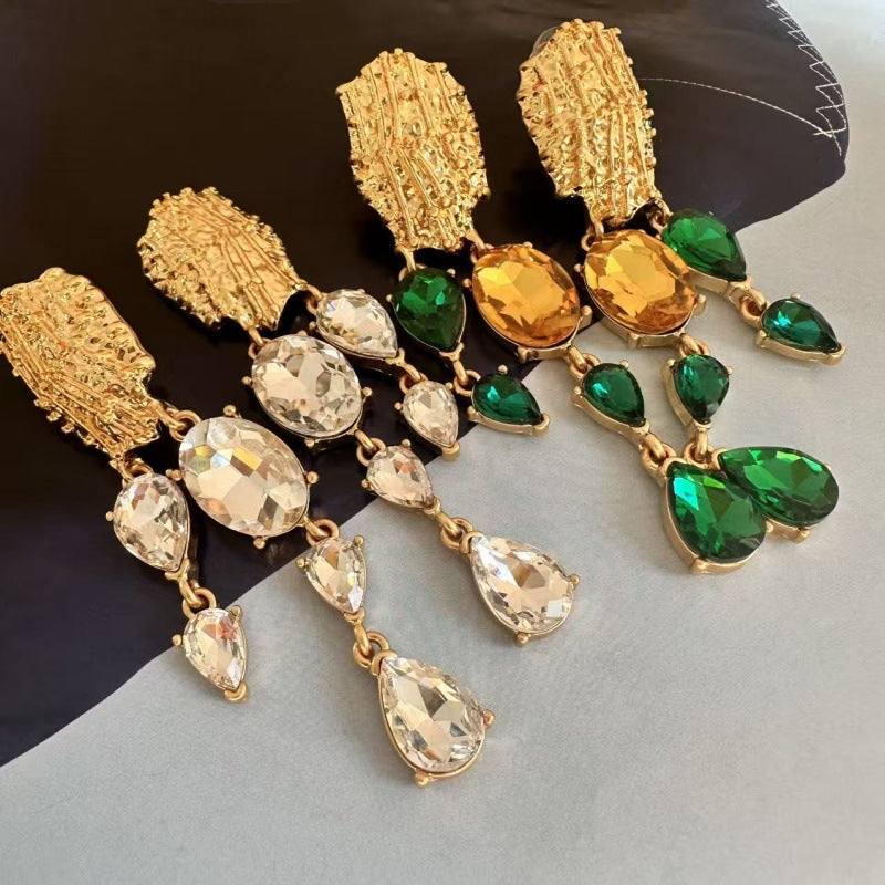 Gold crystal tassel earrings with green and amber teardrop stones