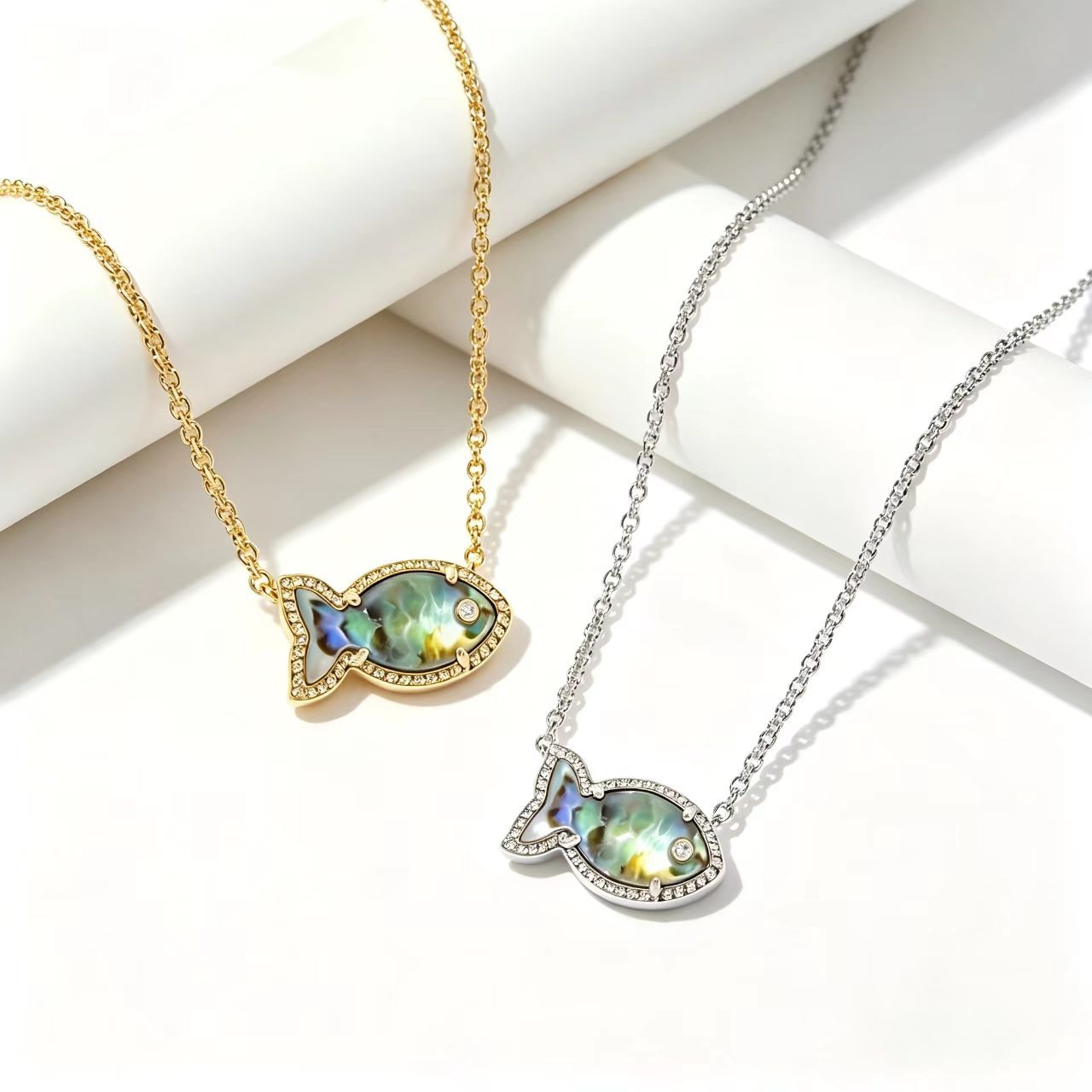 Fish-shaped iridescent pendant necklace, gold and silver tone