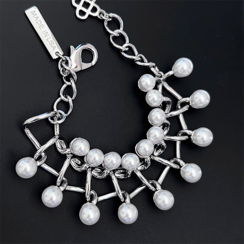 Silver pearl intertwined-link necklace with lobster clasp and dangling charm tags