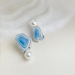 Pair of blue enamel drop earrings with white pearls on silver-tone studs