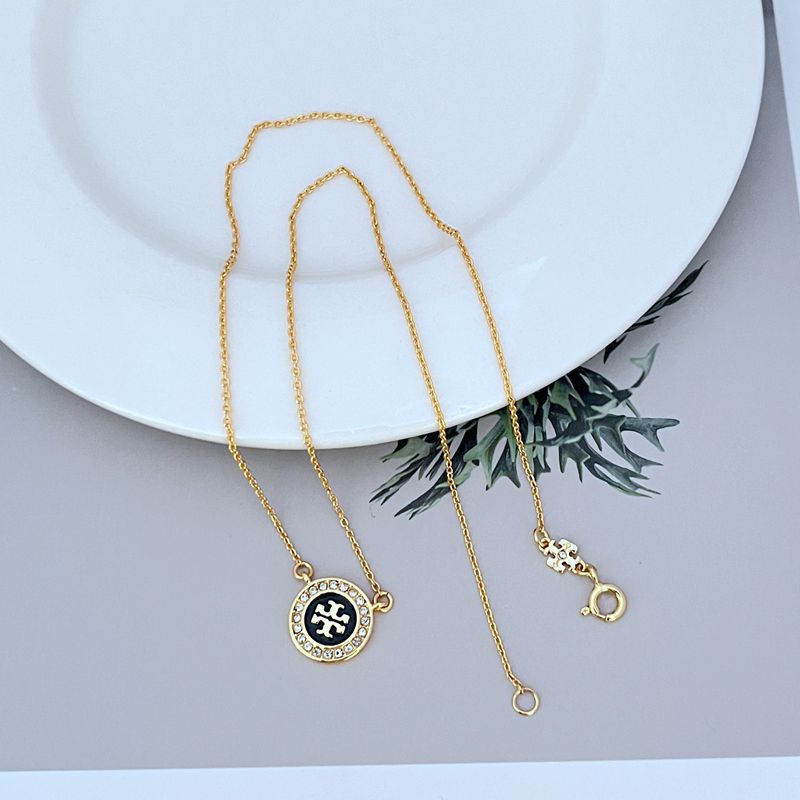 Gold-tone pendant necklace with round logo enamel medallion and adjustable lobster clasp