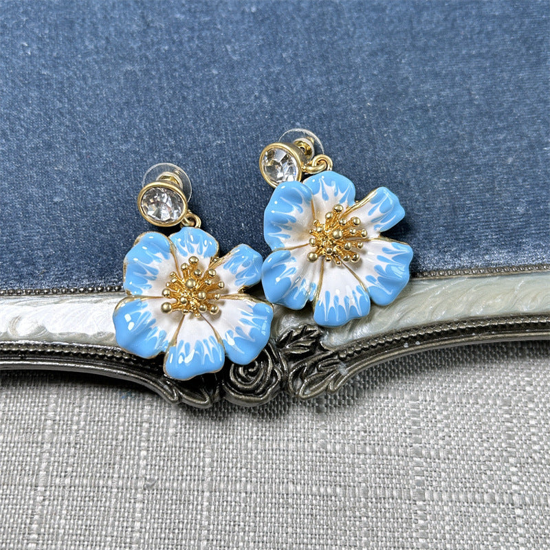 Vintage enamel cherry blossom earrings in light blue and white with gold beaded centers