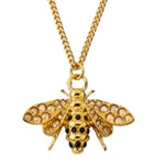 Gold curb chain with circular clasp and bee pendant, diamond-like wing stones