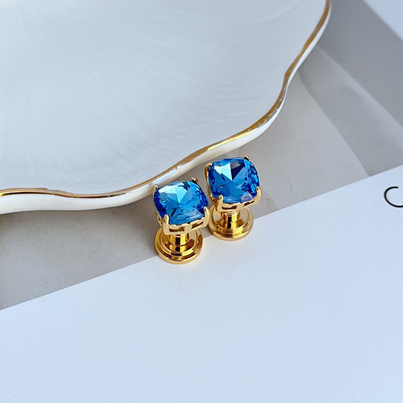 Geometric square stud earrings with sky blue rhinestones and gold-tone posts
