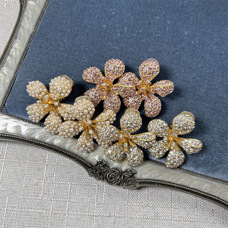 Diamond five-petal flower earrings with pink-purple pavé stones and floral drops