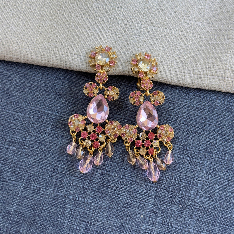 Rhinestone tassel clip-on earrings with pink stones, clear drops, and gold details