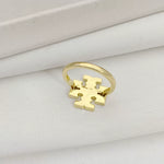Gold logo ring with geometric cutout design on the front panel