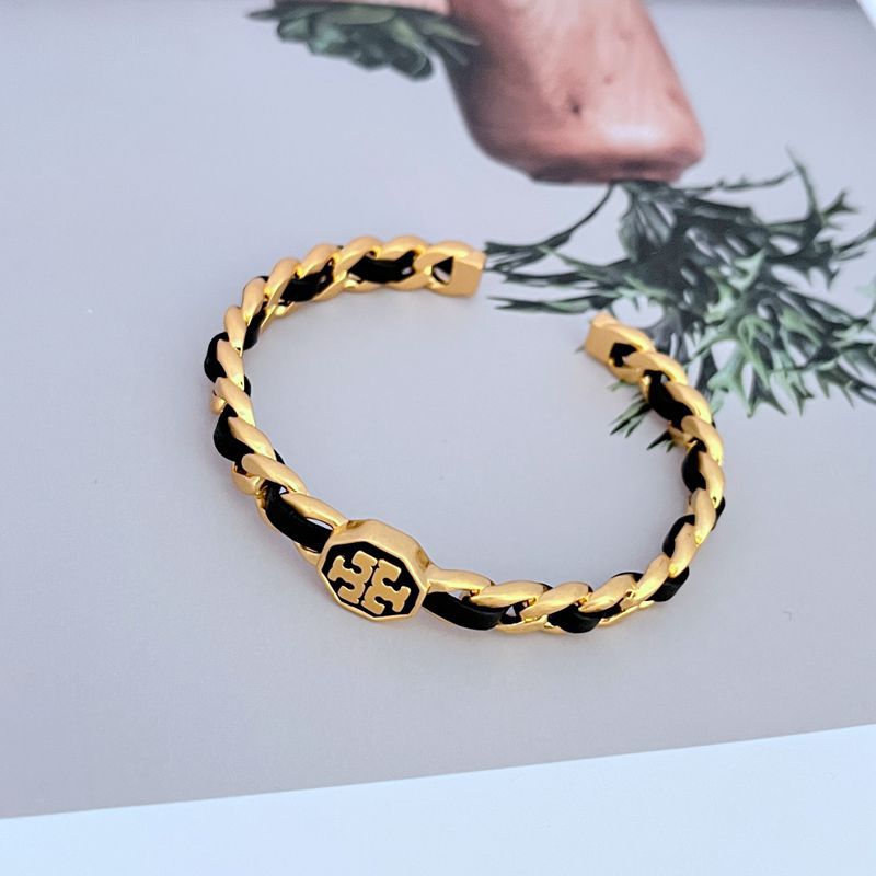 Offenes Cuff-Armband aus gewobenem Leder, goldfarbene Glieder mit schwarzen Akzenten