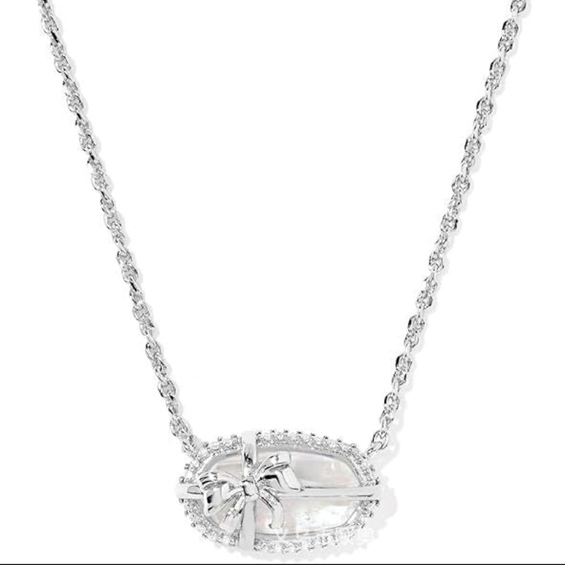 Elisa bow pendant necklace with clear/white center, silver chain and pavé border