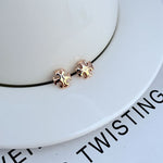 Sweet Petite logo metal stud earrings, rose-gold tone, small geometric design