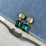 Earrings with green rectangular stones and gold stud caps, square pendant dangle