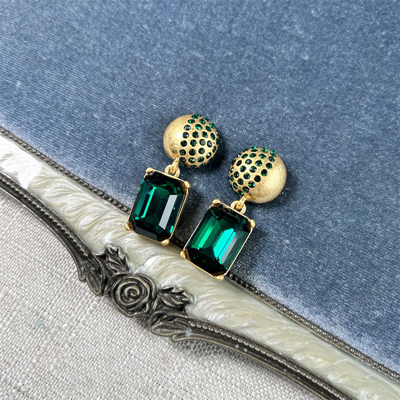 Earrings with green rectangular stones and gold stud caps, square pendant dangle