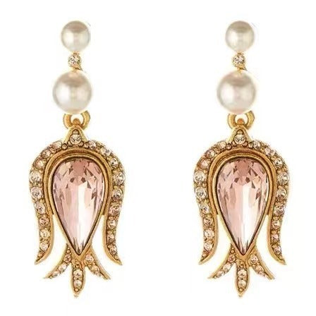 Champagne gold tulip drop earrings with pink pear crystal centers, pearls, and diamond trim