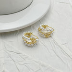 Gold-tone layered hoop earrings with rows of faux pearl beads