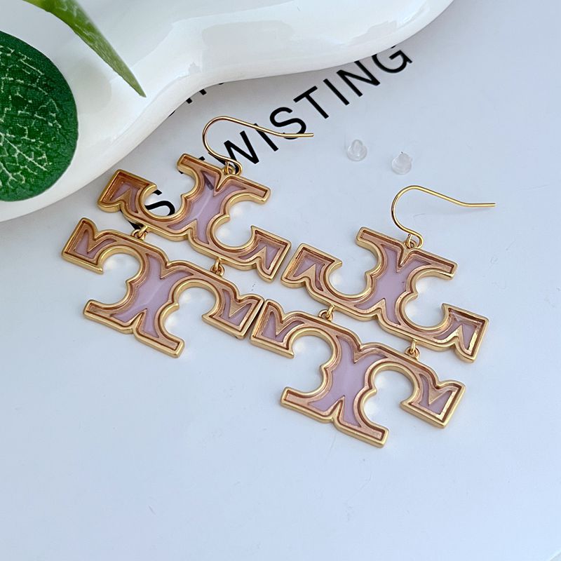 Purple and gold drop earrings with dangling logo monogram charms and hook backs