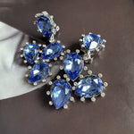 Cactus-cut sparkling glass diamond ear clips in royal blue with silver-tone settings