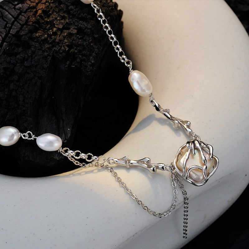Rustic yet Elegant Pearl Necklace with a Draped Chain

