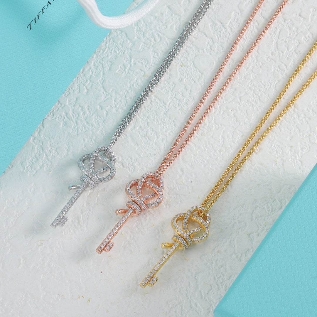 Three-tone key pendant necklaces with pavé knot and short key charms