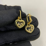 Three-diamond heart earrings, gold-tone heart with three small round diamonds