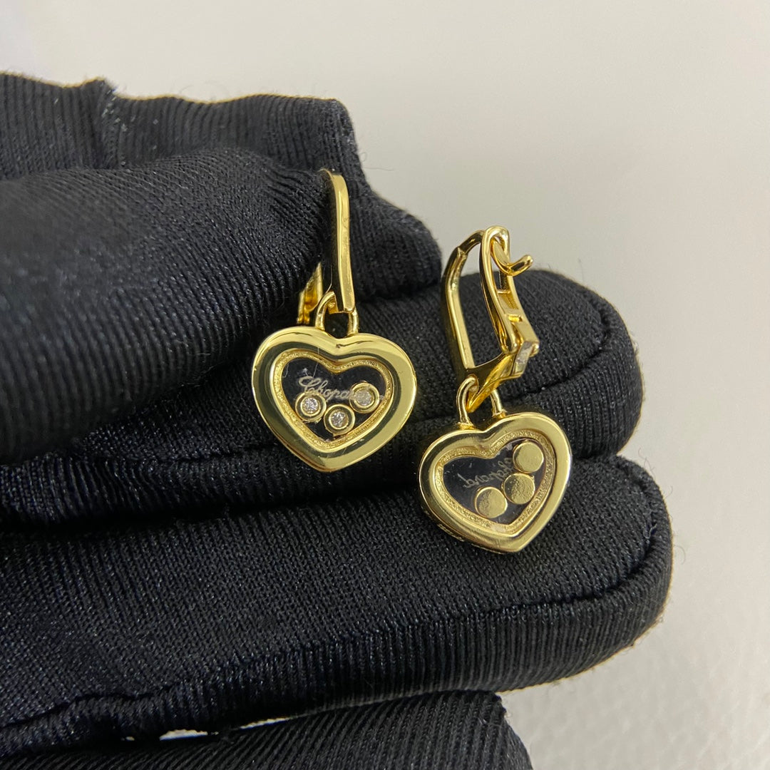Three-diamond heart earrings, gold-tone heart with three small round diamonds